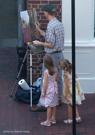 Photo of Robert painting with two friendly citizens in Annapolis Maryland